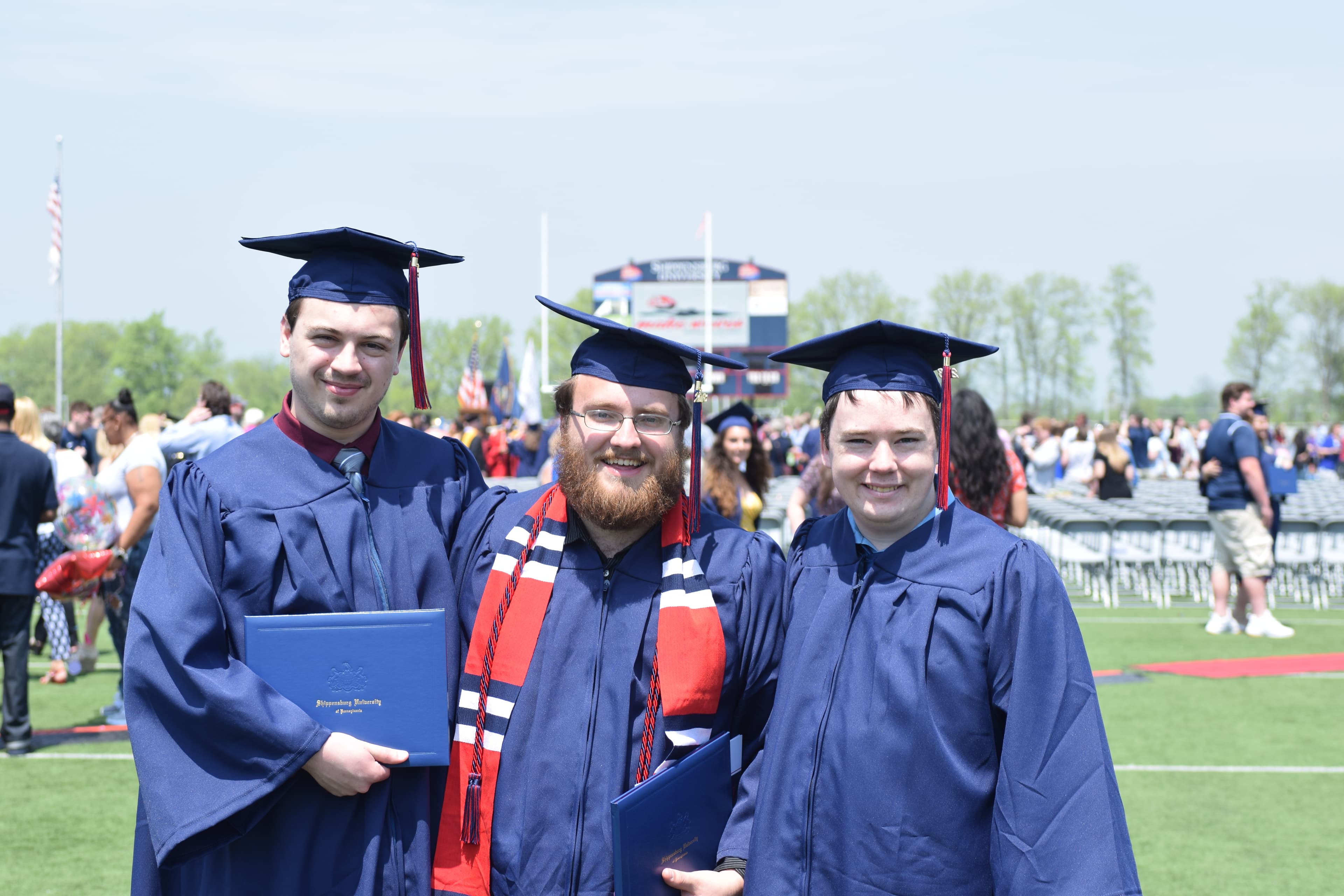 Picture of Chirs with friends at college graduation